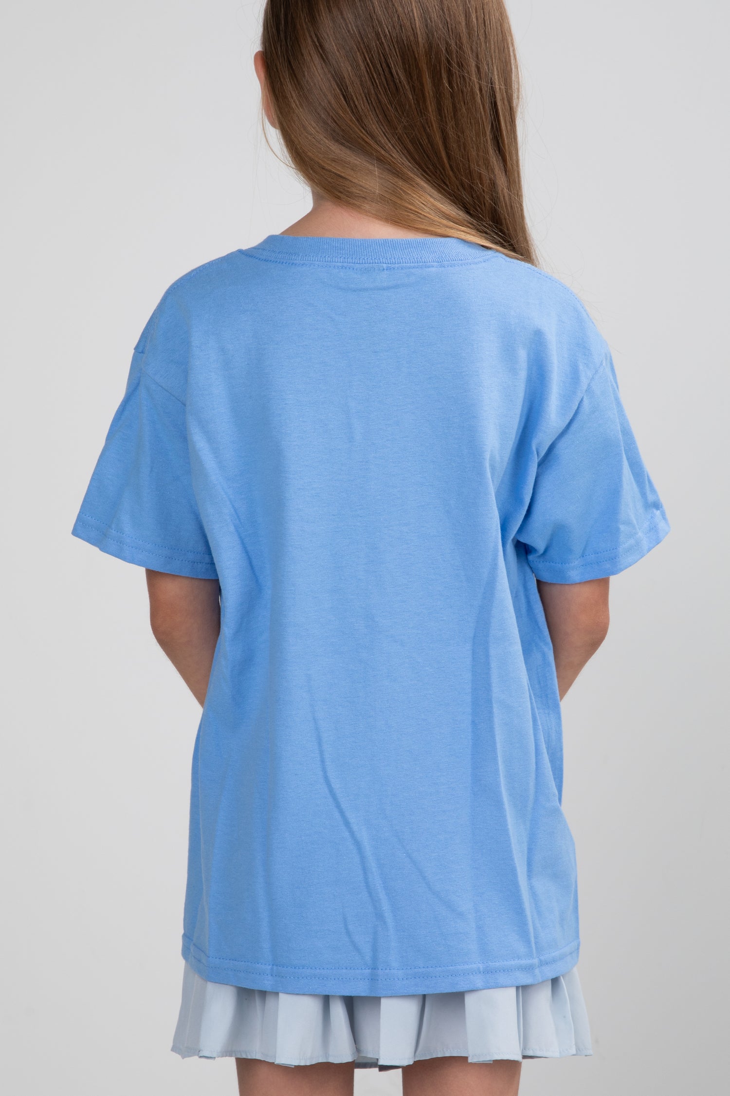 Person wearing a blue t-shirt on a plain background