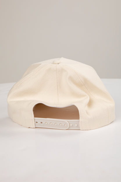 Beige cap on a light gray background