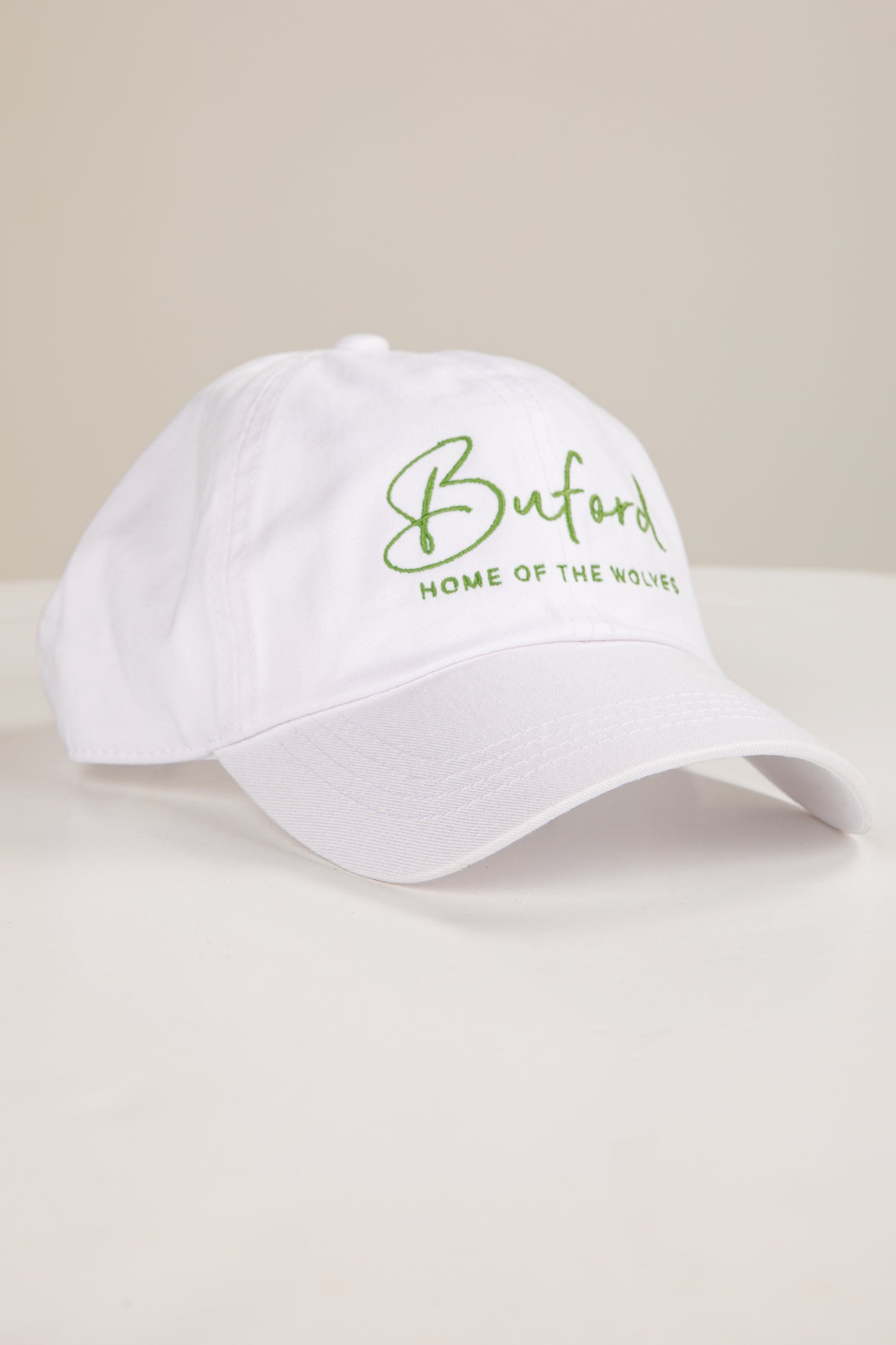 White cap with green text &