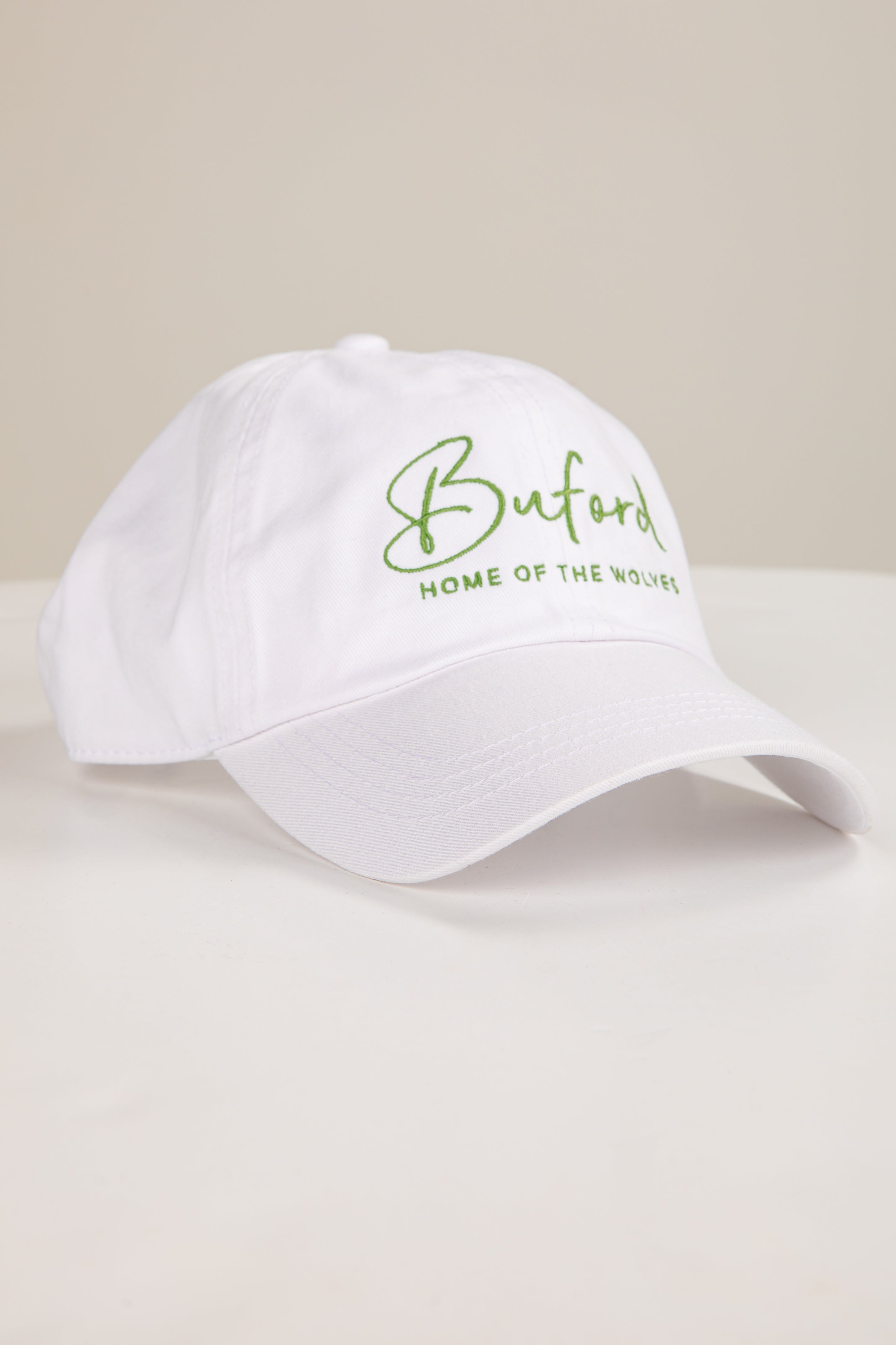 White cap with green text &
