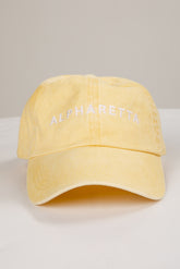Yellow cap with &