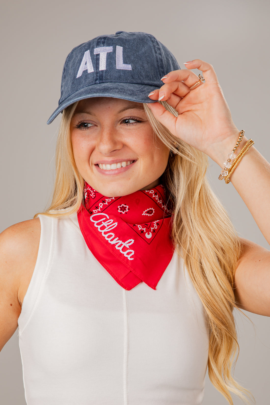 Woman wearing a denim cap with &