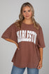 Woman wearing a brown oversized t-shirt with &