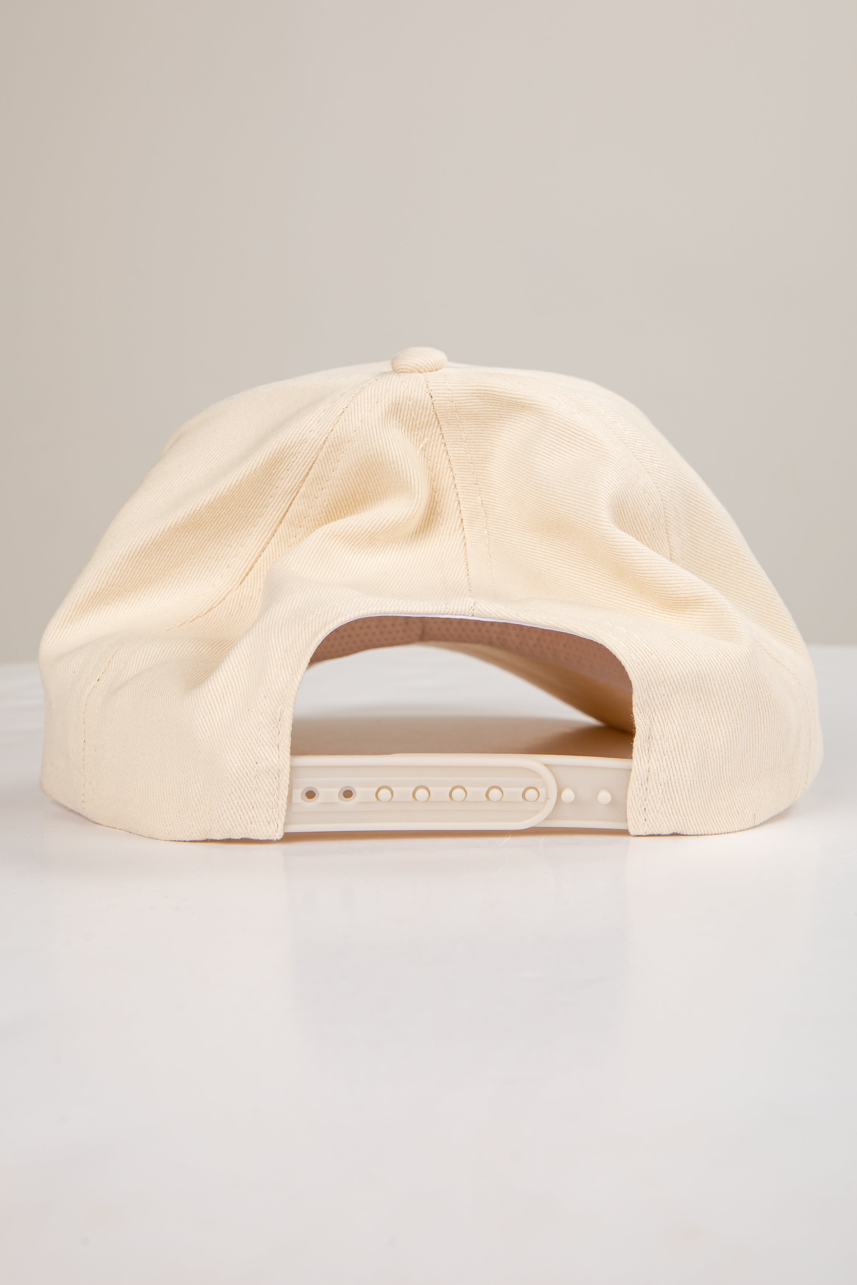 Beige cap on a light gray background