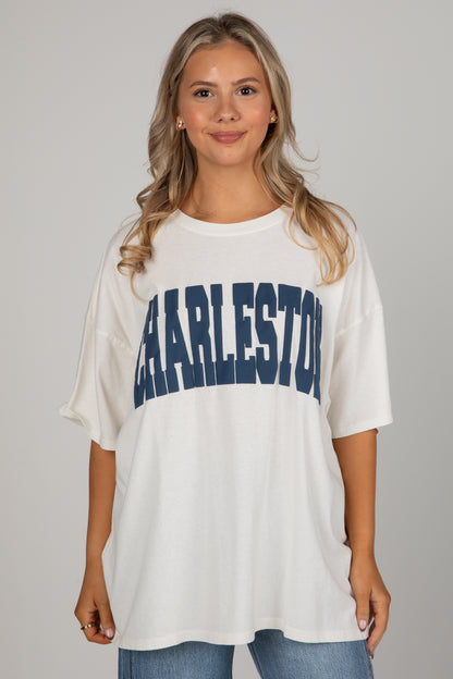 Woman wearing a white t-shirt with &