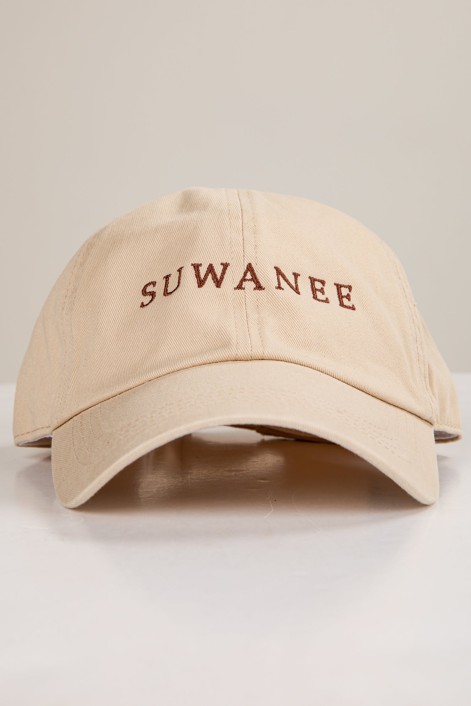 Beige cap with &