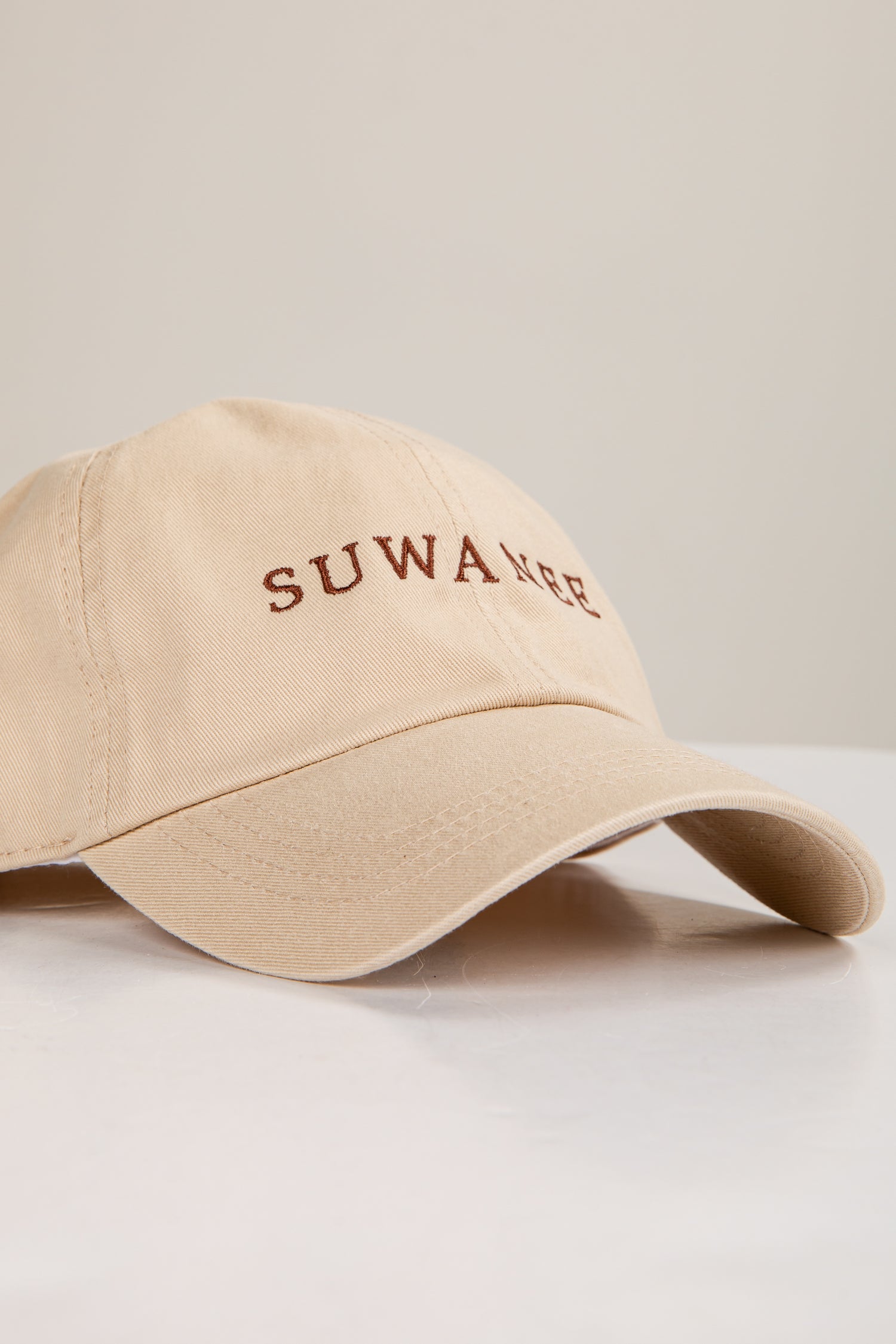 Beige cap with &