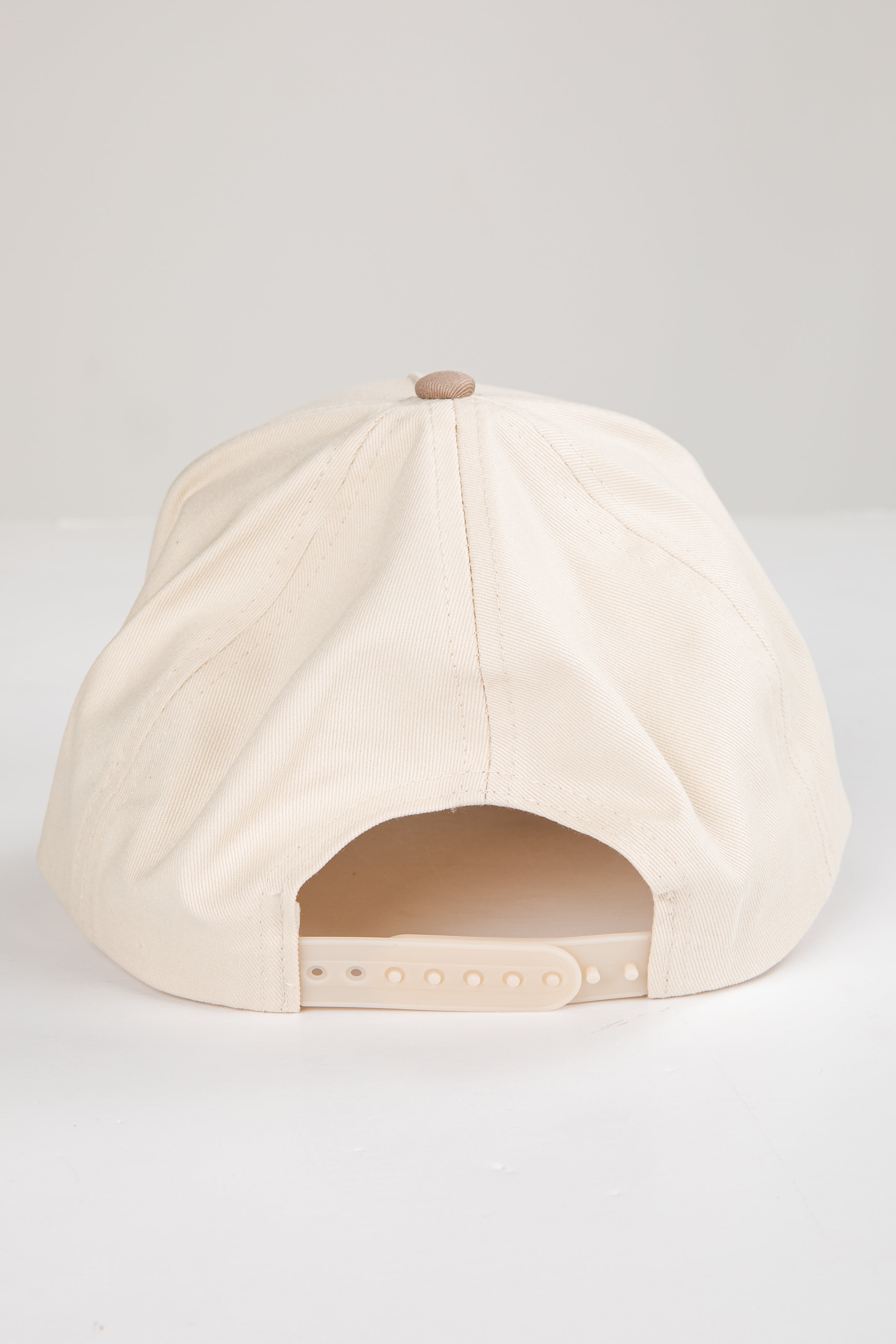 Beige cap on a white background