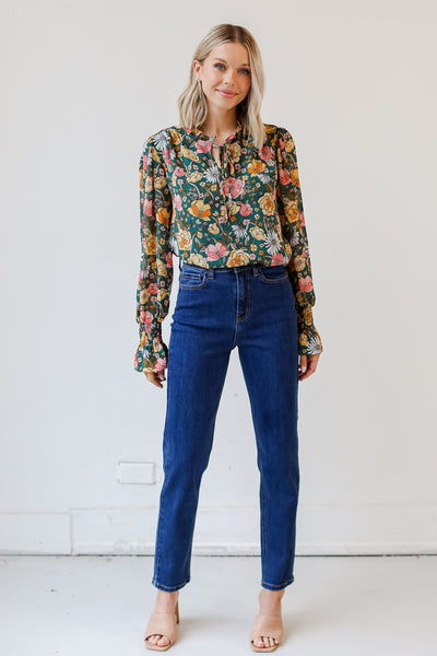 dark wash Mom Jeans with a floral blouse