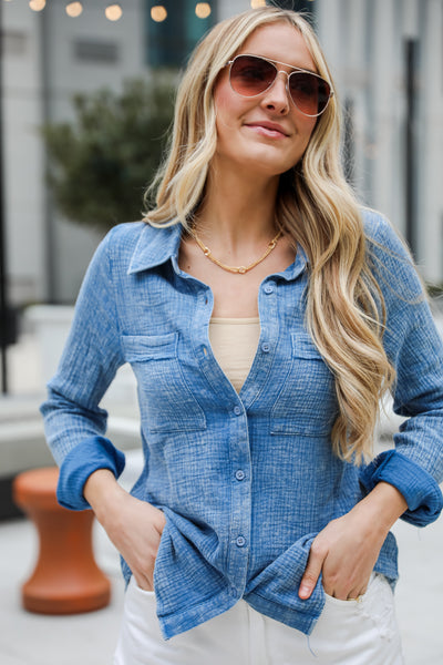 Morgan Denim Linen Button-Up Blouse features, Lightweight Crinkle Linen Fabrication, Acid Washed, Collared Neckline, Functional Button Front long Sleeves with Functional Button Cuffs