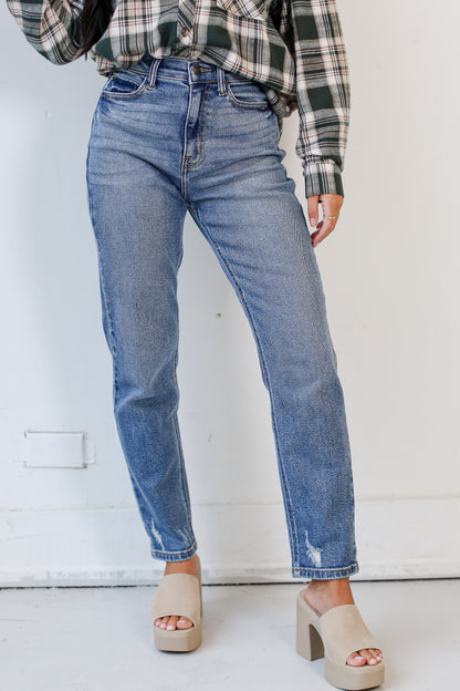 trendy medium wash Mom Jeans close up