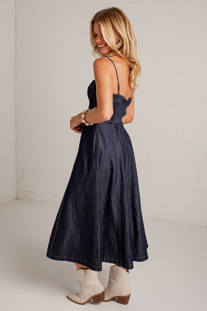 dark-wash dress features a strapless bustier-inspired bodice with defined seaming and a flattering fitted silhouette