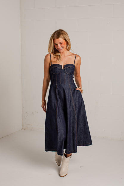 dark-wash dress features a strapless bustier-inspired bodice with defined seaming and a flattering fitted silhouette