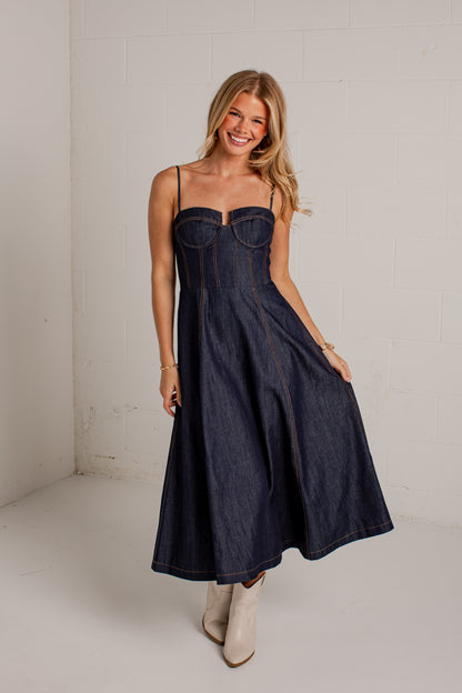 dark-wash dress features a strapless bustier-inspired bodice with defined seaming and a flattering silhouette