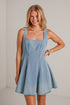 light-wash dress features a flattering scoop neckline, wide tank straps, and a fit-and-flare silhouette. 