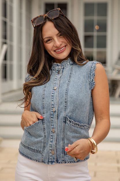 Woman wearing a denim vest outdoors
