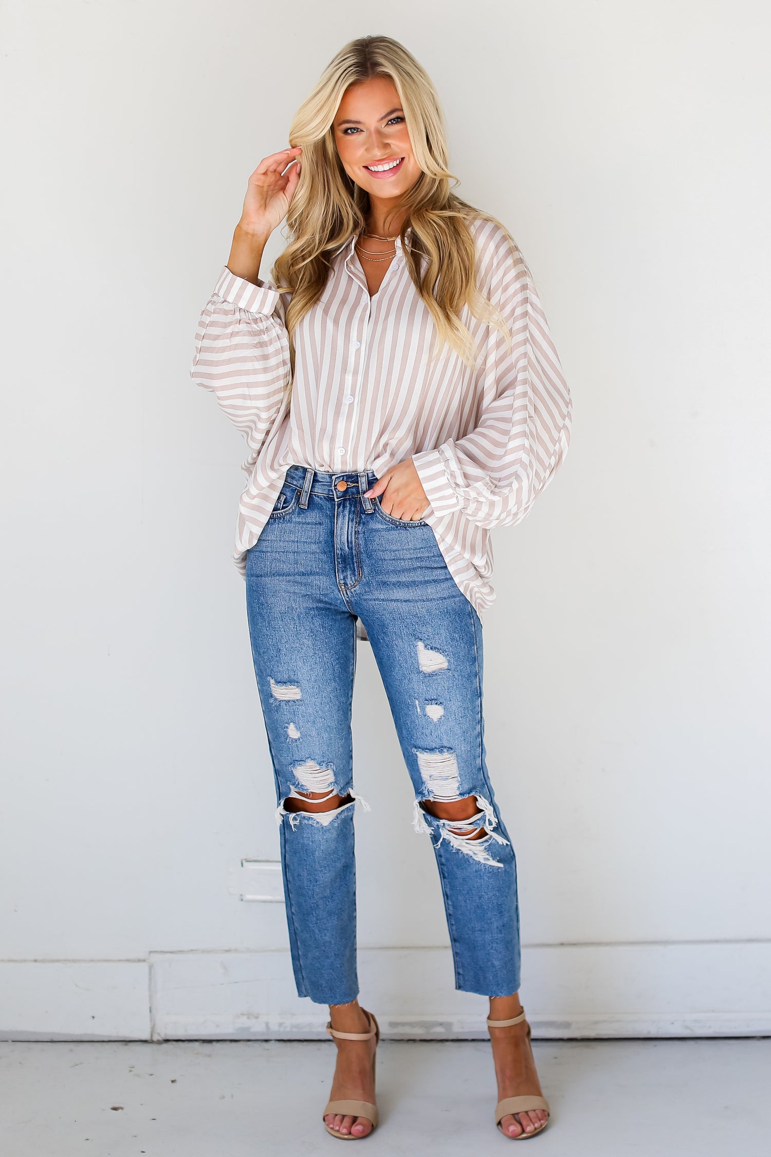 medium wash Distressed Mom Jeans on dress up model