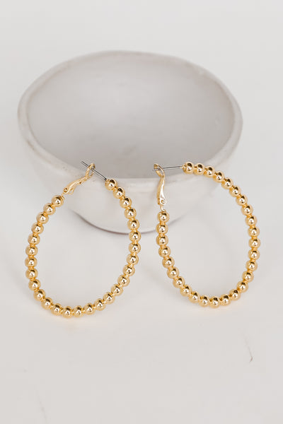Gold Ball Hoop Earrings flat lay