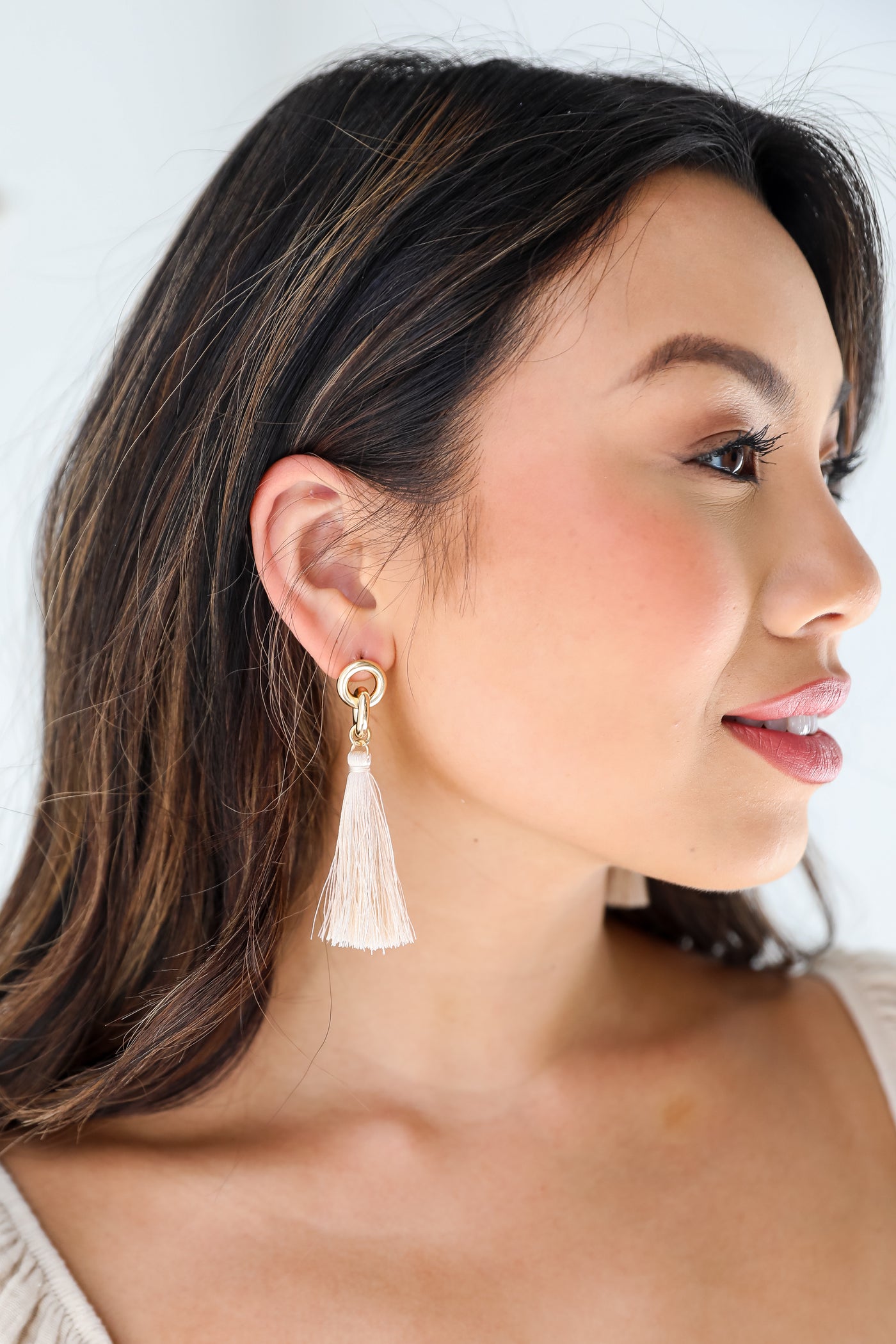 Gold Tassel Earrings on model