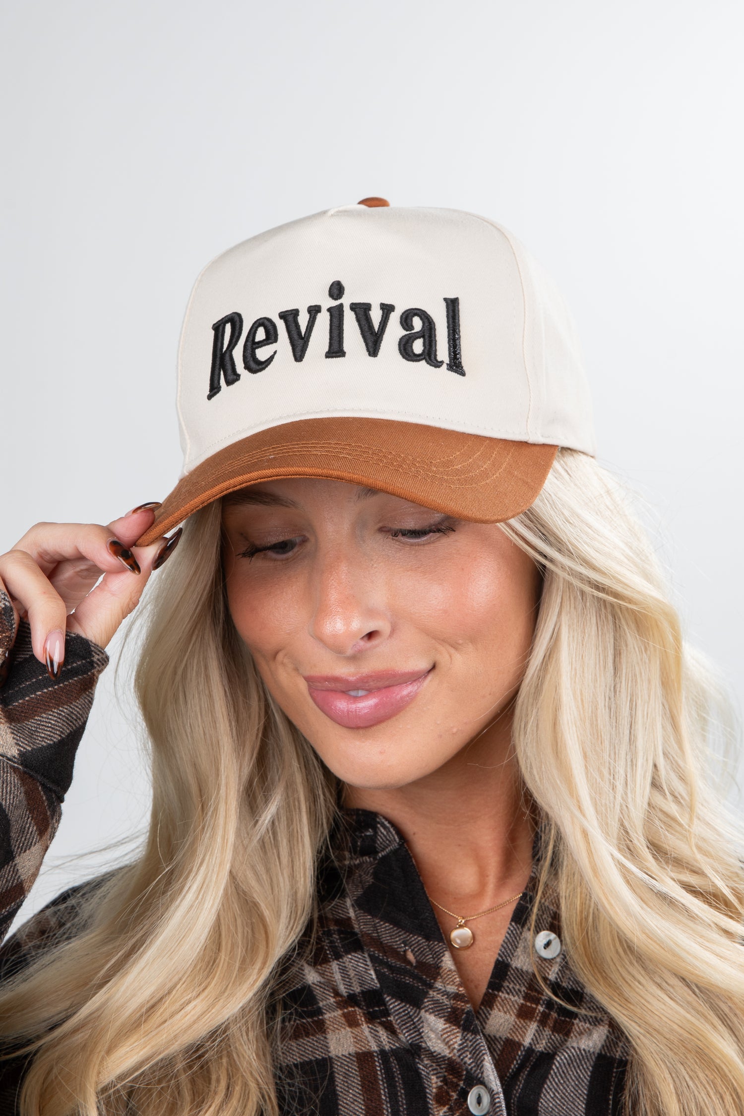 Person wearing a cap with &