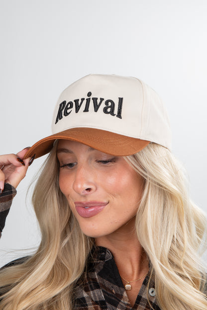 Person wearing a beige cap with &