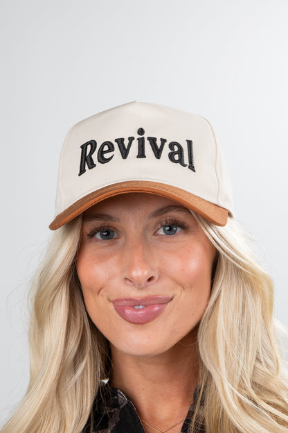 Person wearing a beige cap with &