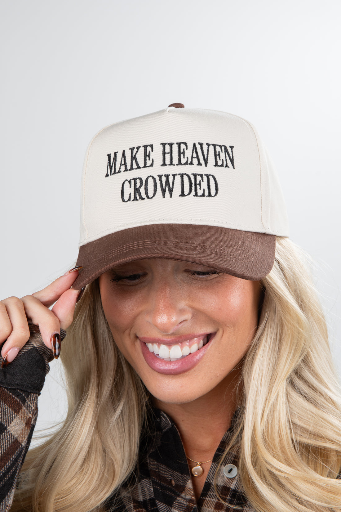 Person wearing a cap with &