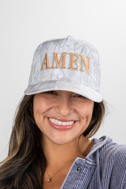 Woman wearing a cap with &