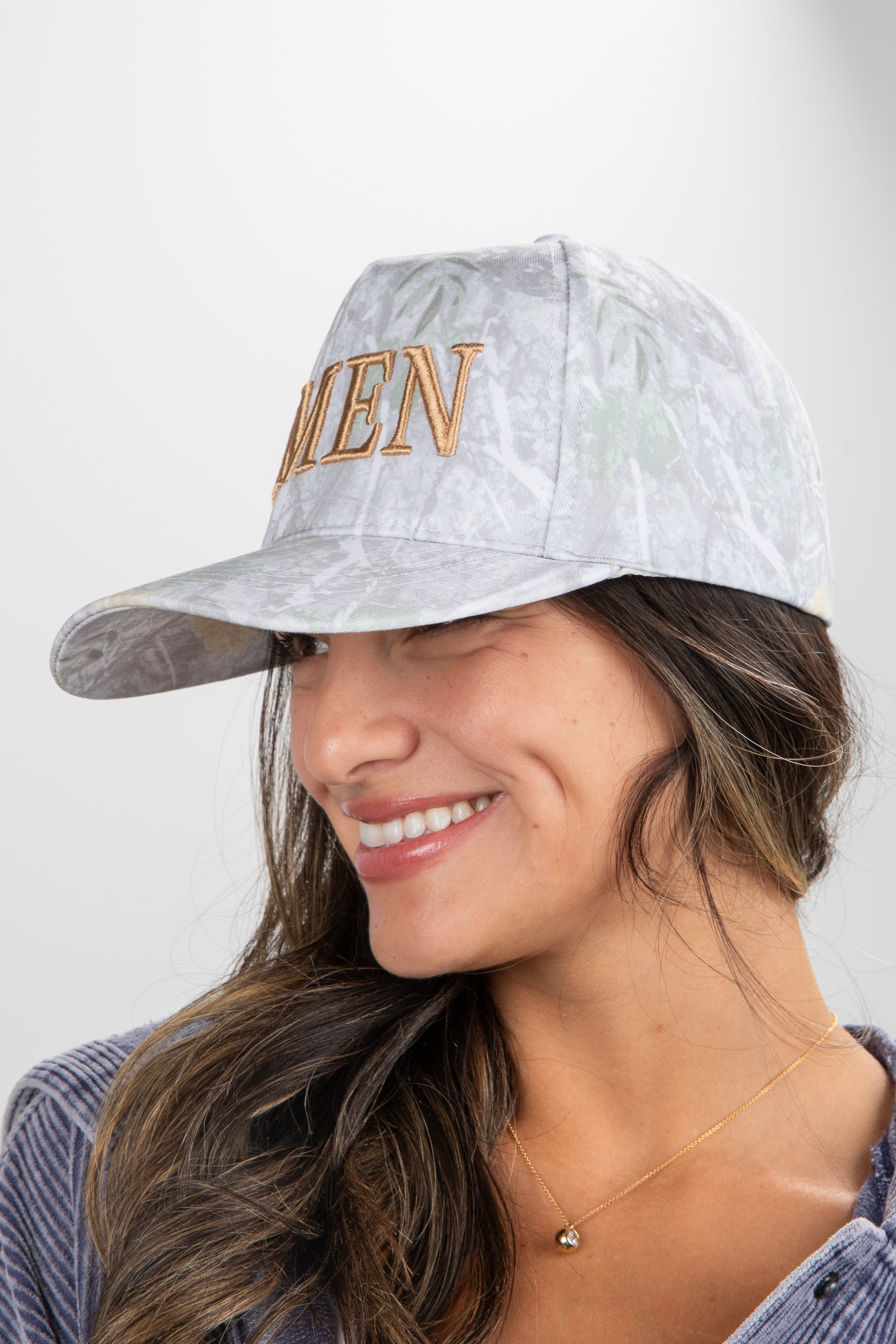 Woman wearing a cap with &