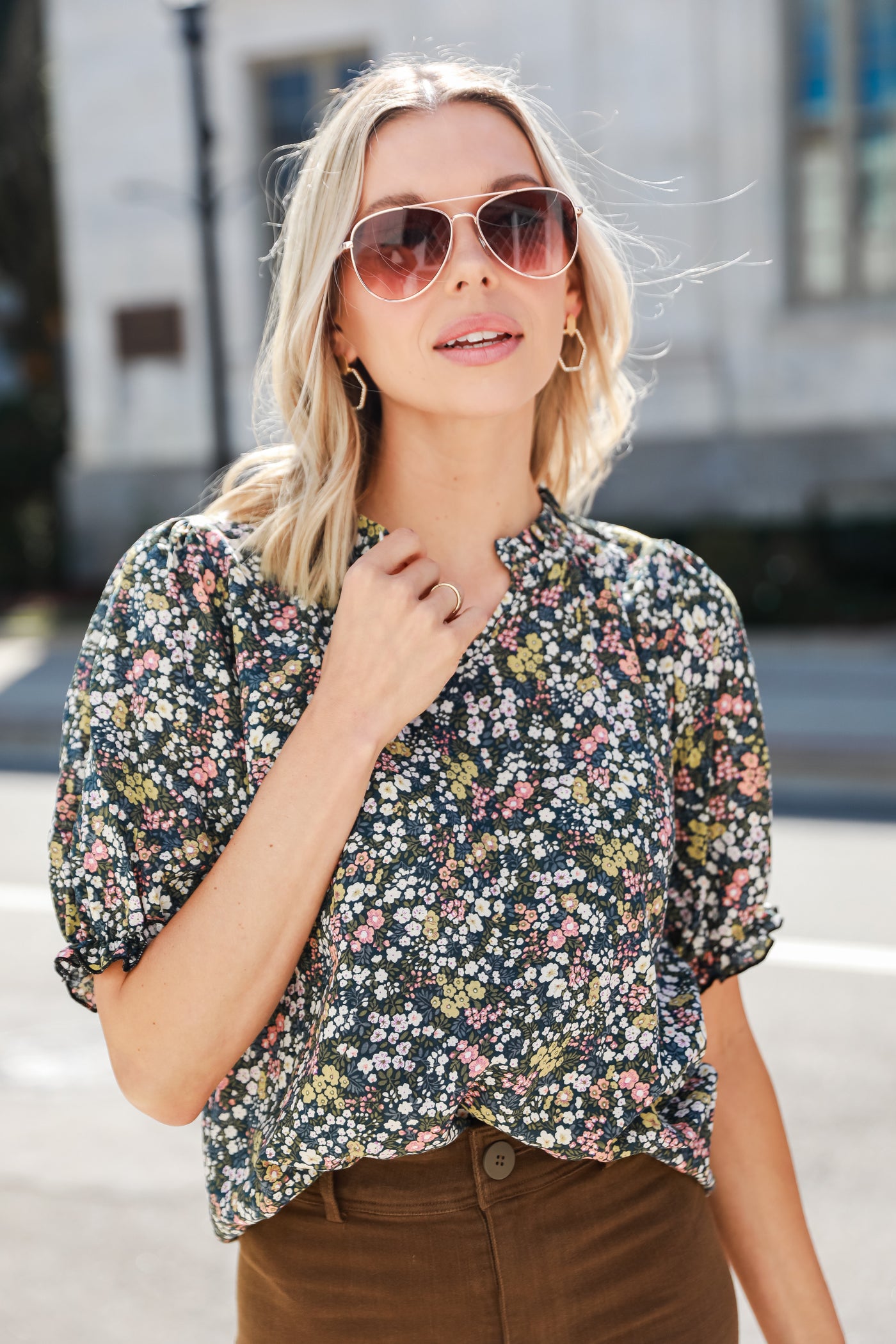 model wearing a cute navy blue Floral Blouse