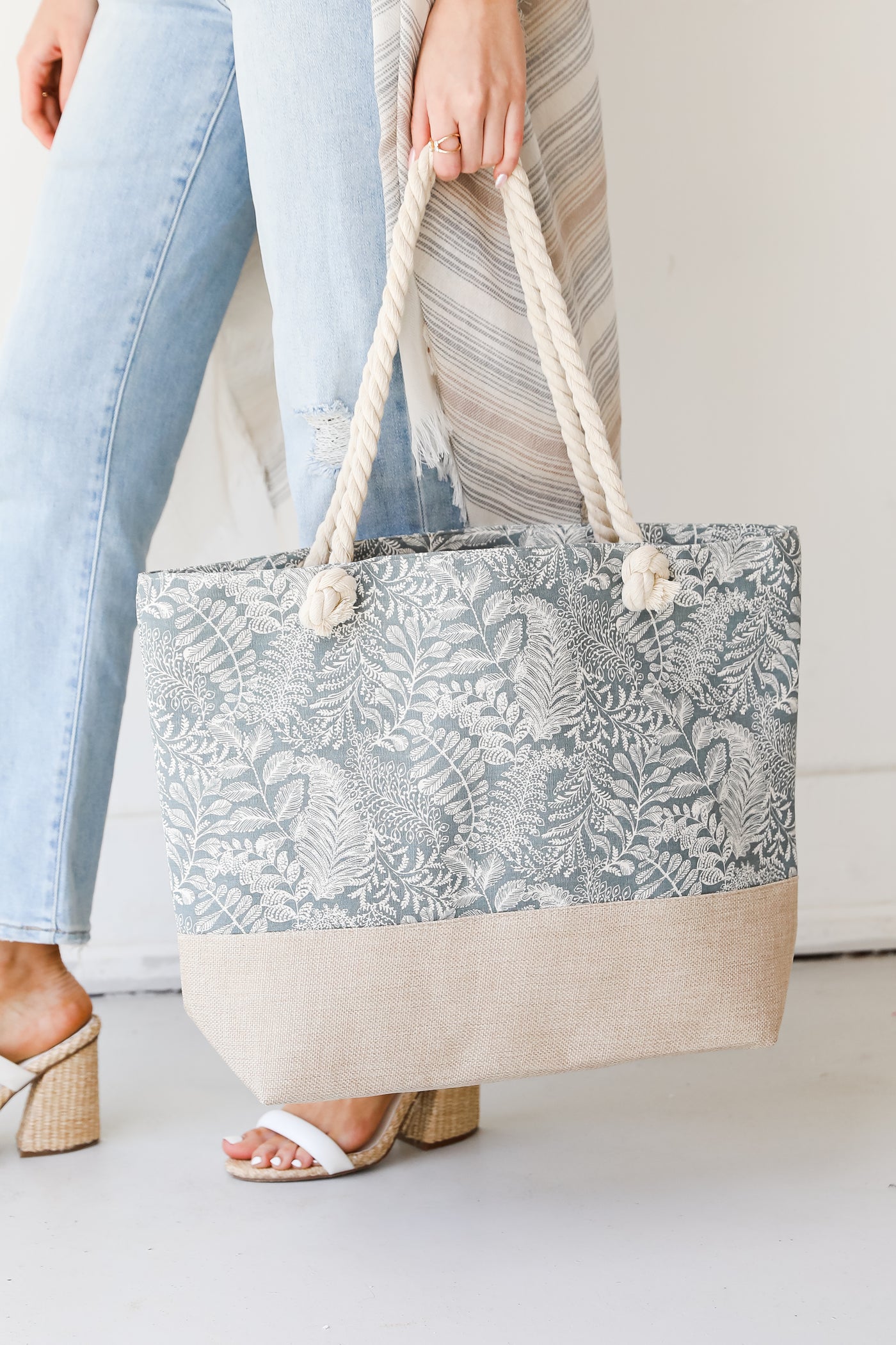 model holding a Grey Tote Bag