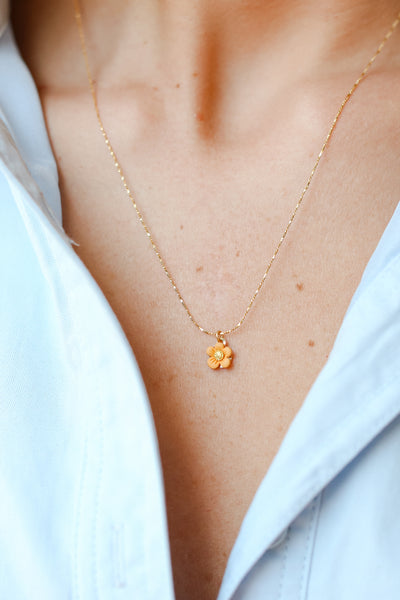 Gold Flower Charm Necklace on model