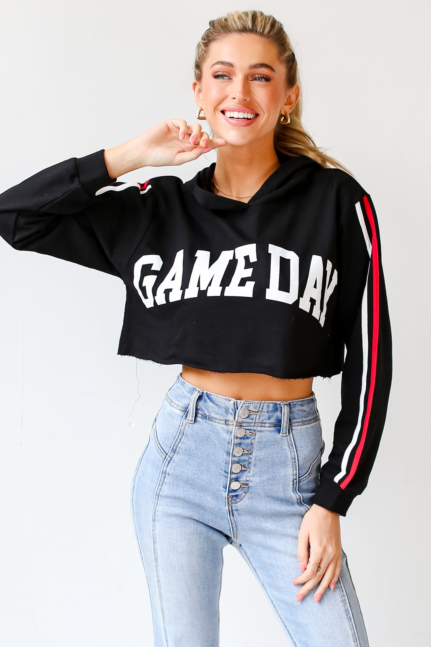 Game Day Cropped Hoodie on model with light wash jeans