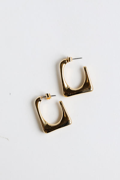 Gold Geometric Hoop Earrings flat lay