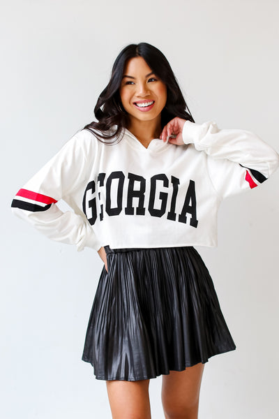 Ivory Georgia Cropped Hoodie on model with a black leather mini skirt