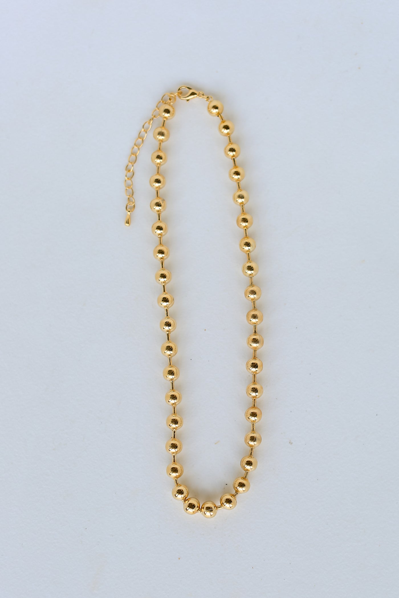 Gold Beaded Necklace flat lay