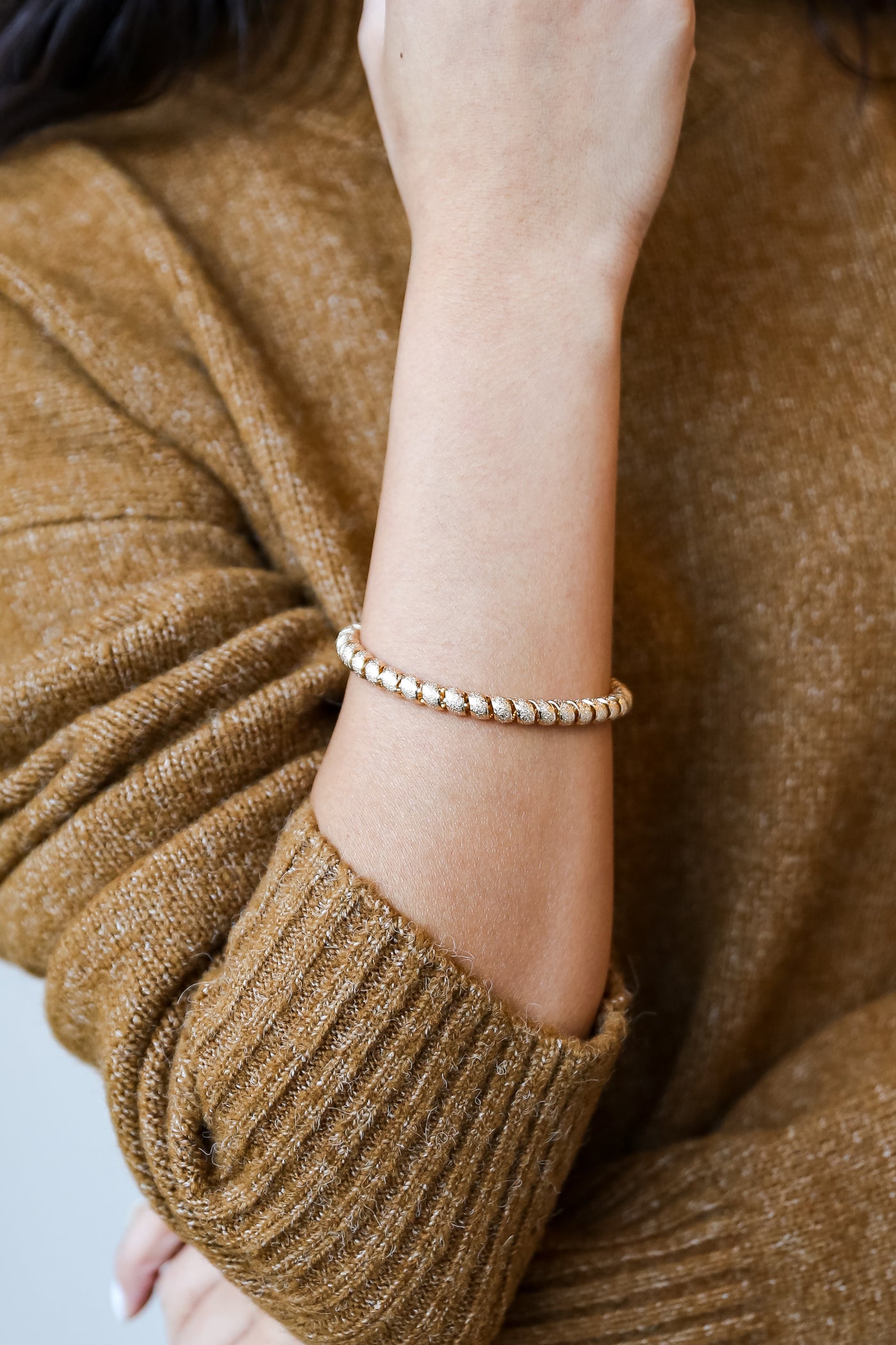 Gold Twisted Cuff Bracelet on model