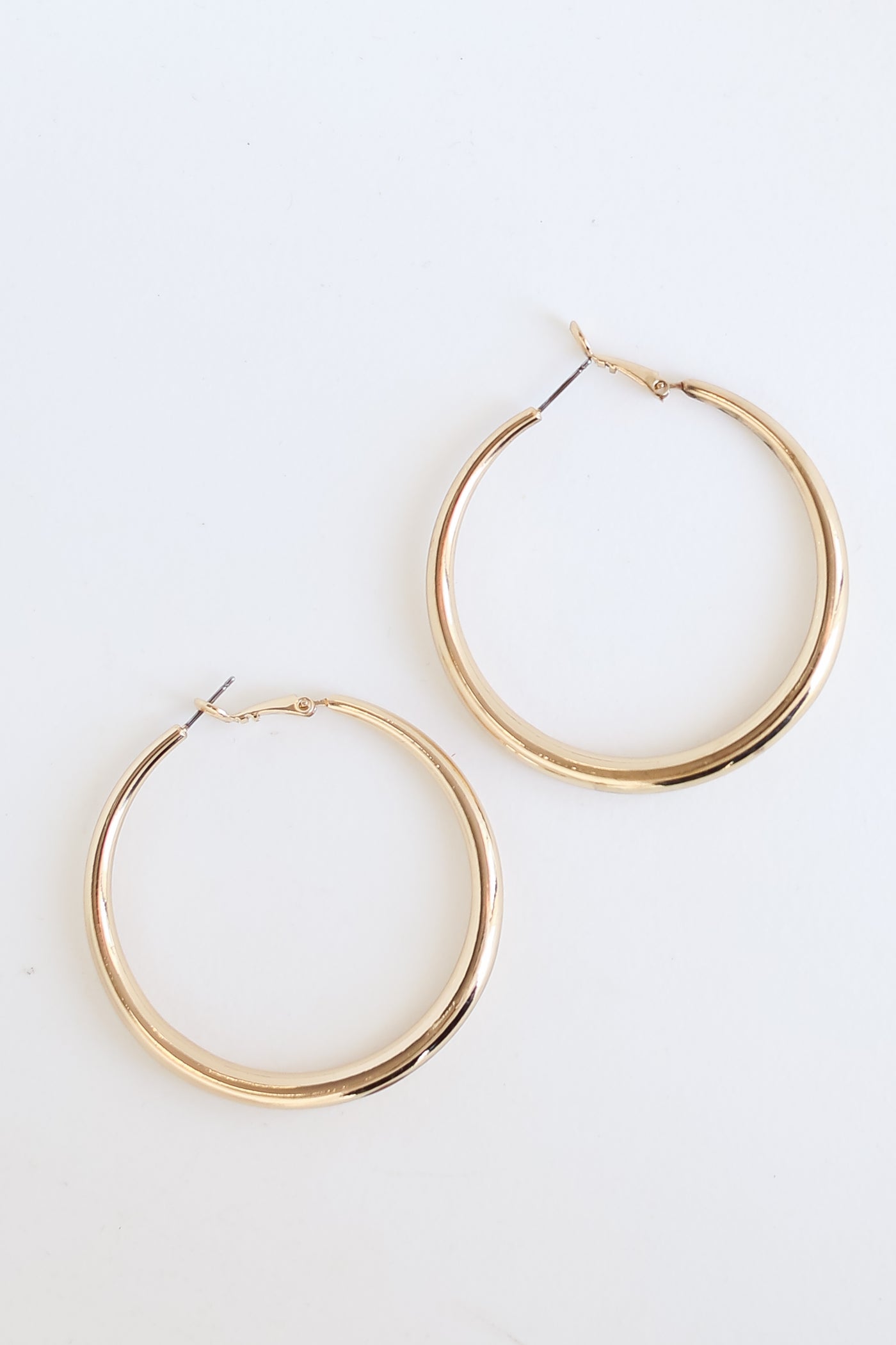 Gold Hoop Earrings flat lay