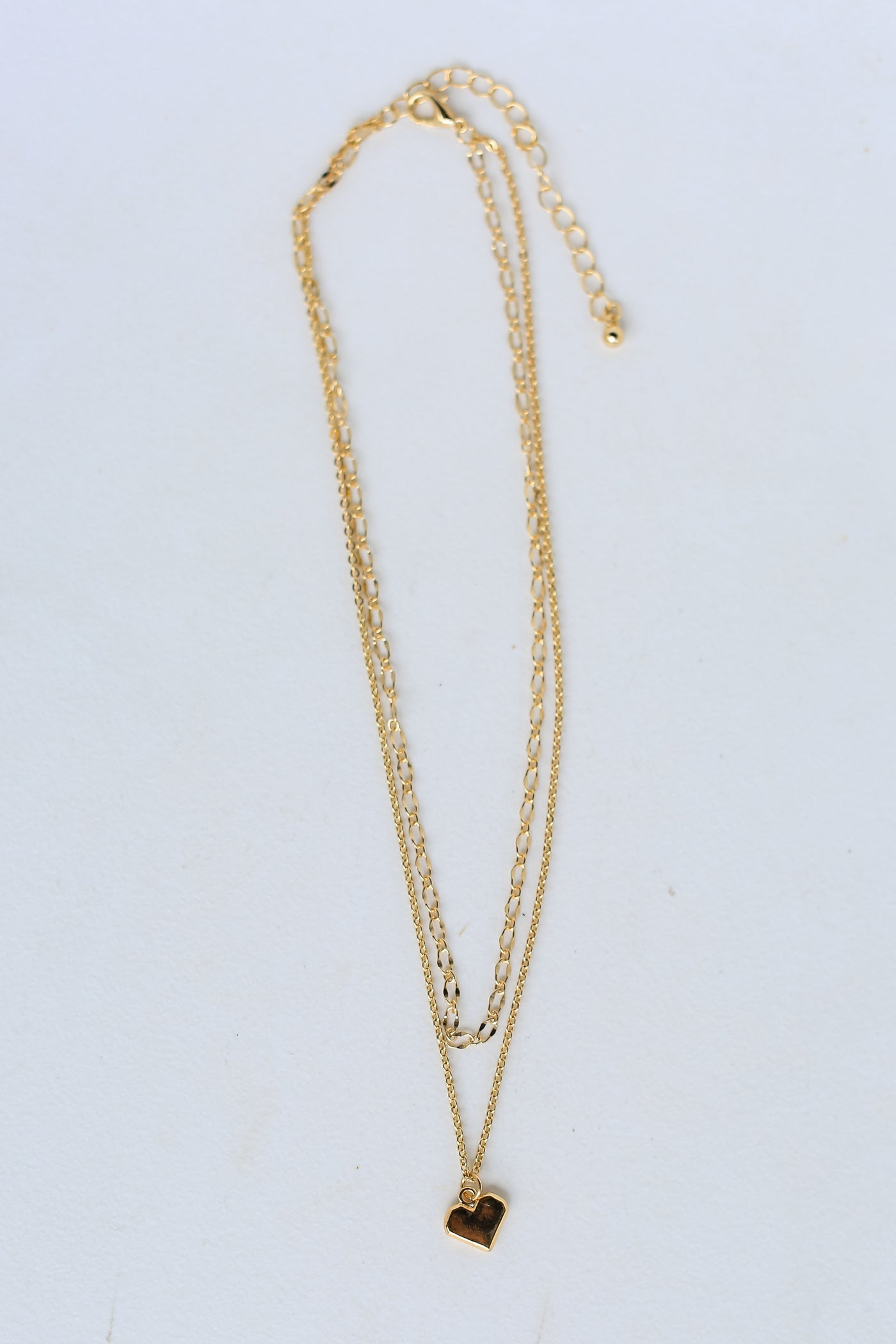 Gold Layered Heart Charm Necklace flat lay