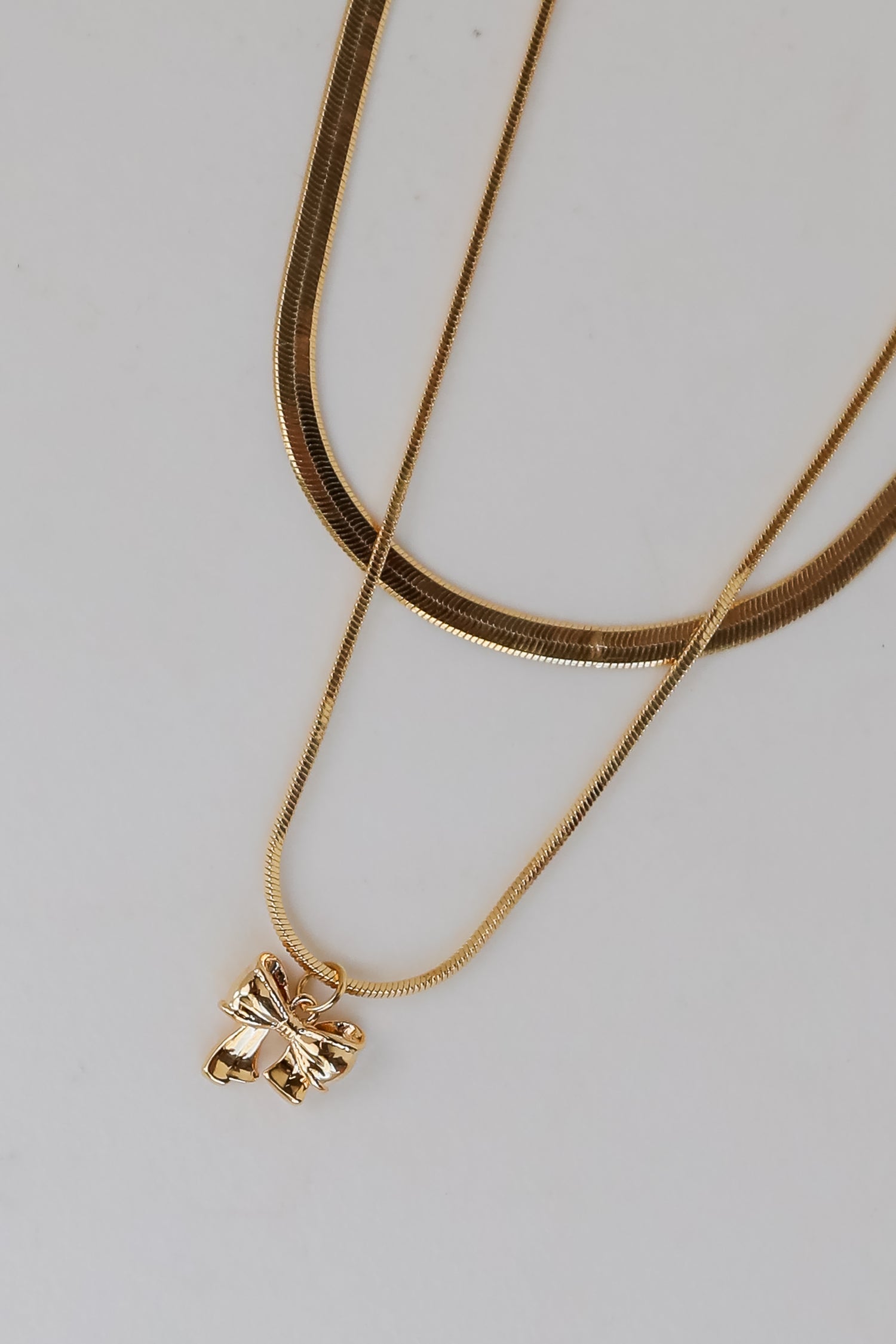 Gold Bow Charm Layered Snake Chain Necklace | Bow Jewelry | DressUp Gold Bow Charm Layered Snake Chain Necklace | Bow Jewelry | DressUp