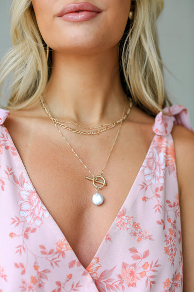 gold Layered Pearl Charm Necklace on model