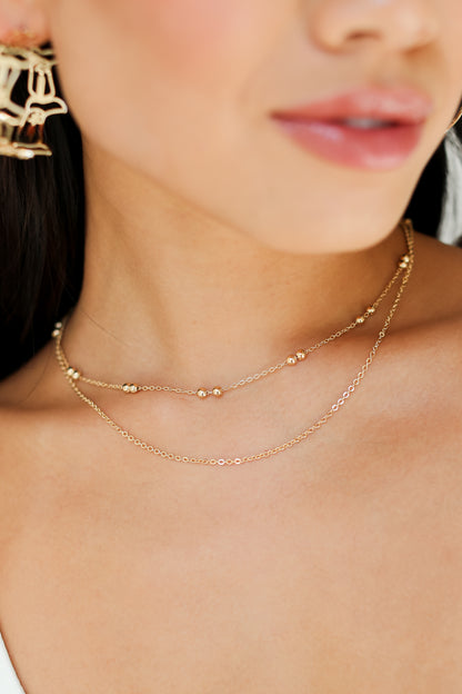 Gold Layered Chain Necklace on model