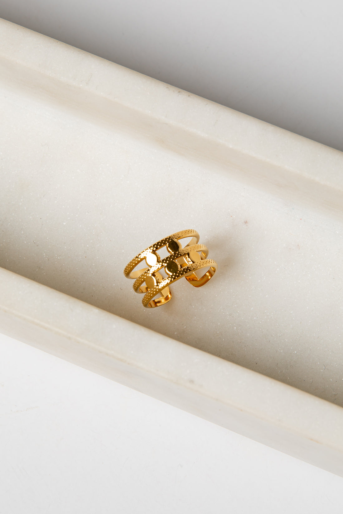 Gold ring on a marble surface