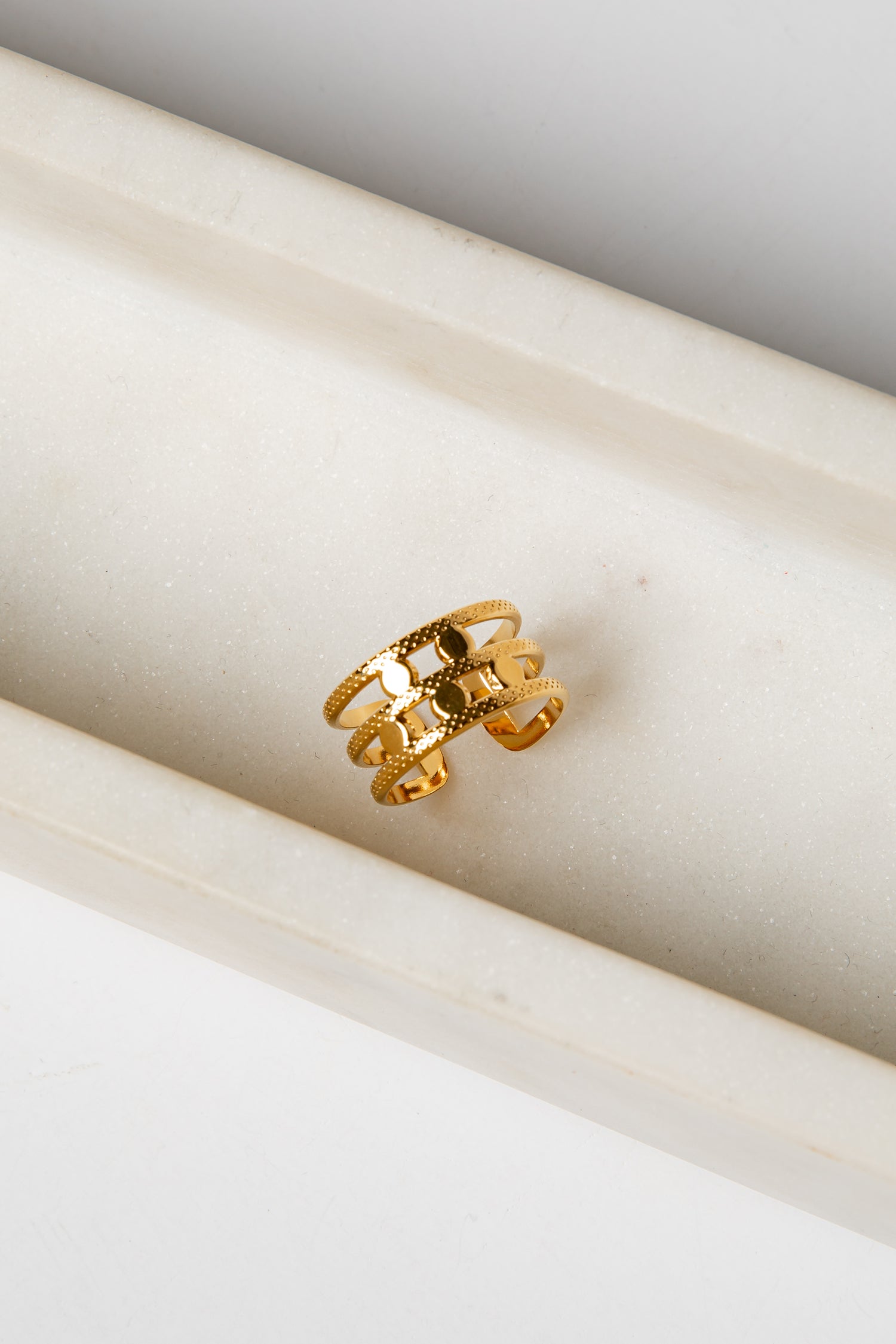 Gold ring on a marble surface