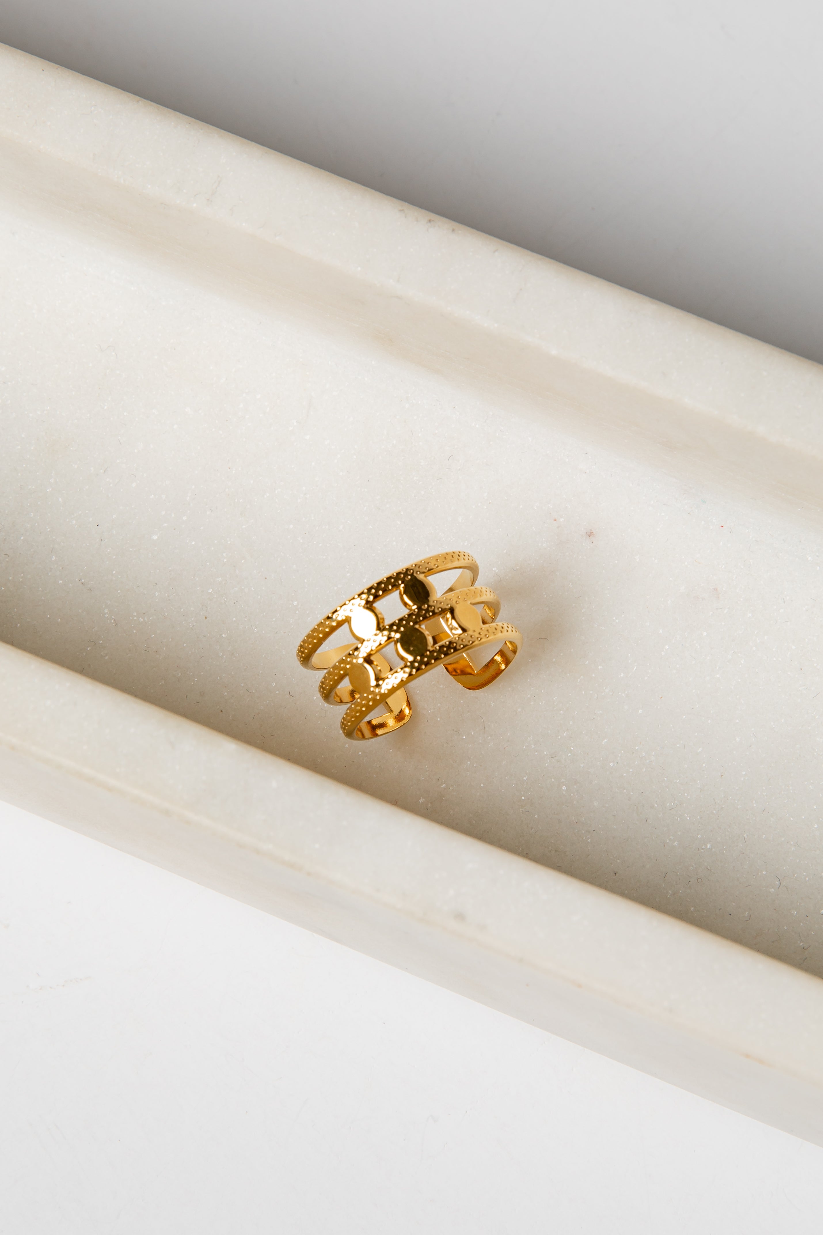 Gold ring on a marble surface