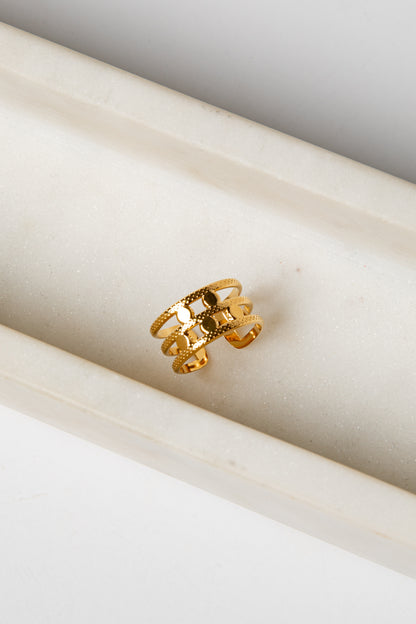 Gold ring on a marble surface