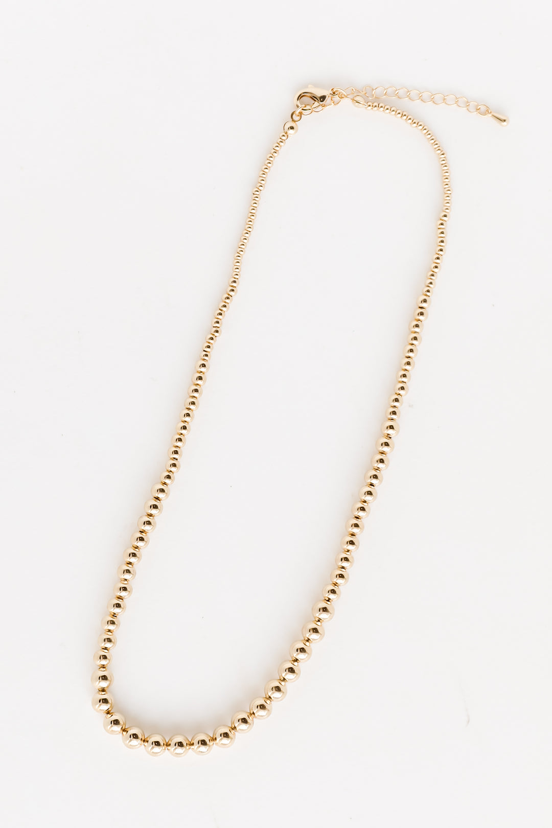 Gold Beaded Necklace flat lay