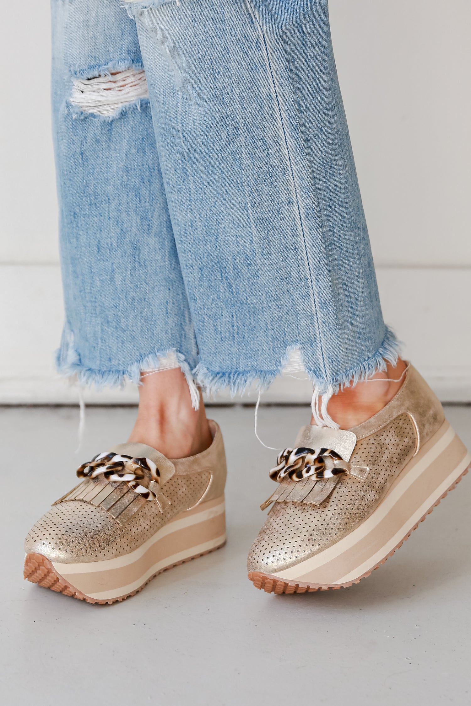 Gold Platform Sneakers on model