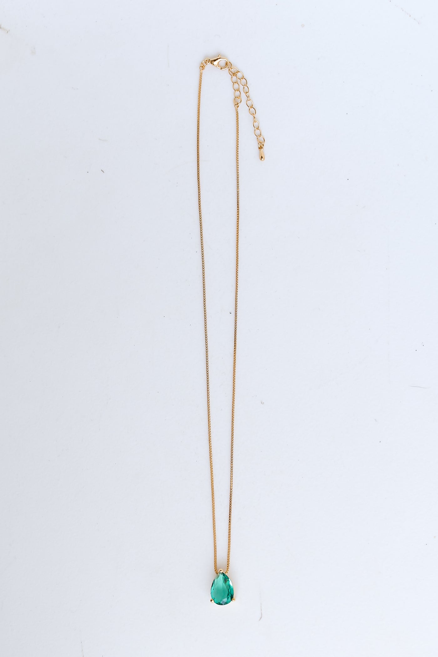 Gold Gemstone Charm Necklace flat lay