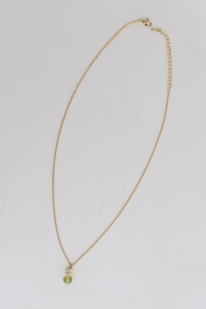 Gold Mini Stone Charm Necklace flat lay